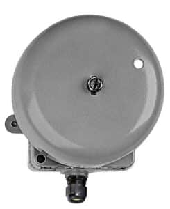 A round, gray signalling bell mounted on a square base with a connector at the bottom.