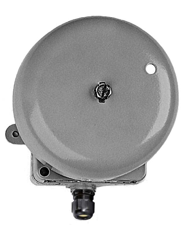A round, gray signalling bell mounted on a square base with a connector at the bottom.