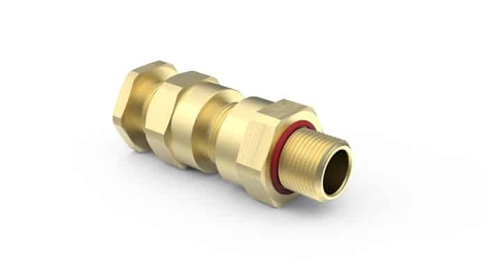 A brass pipe fitting with a threaded end and hexagonal sections, isolated on a white background.