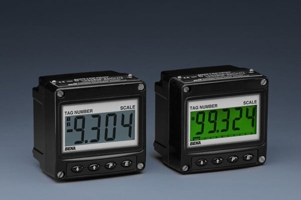 Two digital panel meters with numeric displays showing different readings, one with a green backlight.