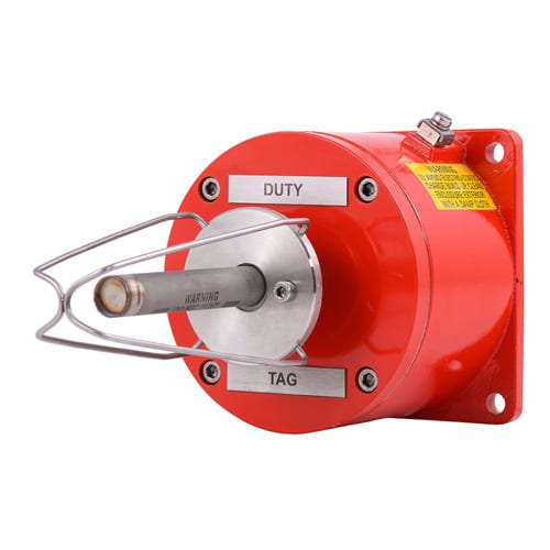 Red industrial manual call point with "DUTY" and "TAG" labels, metal lever, and wall mount.