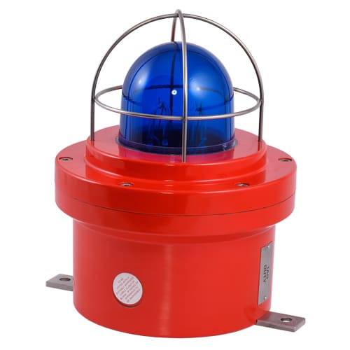 Red industrial warning beacon with a blue light and protective metal cage.