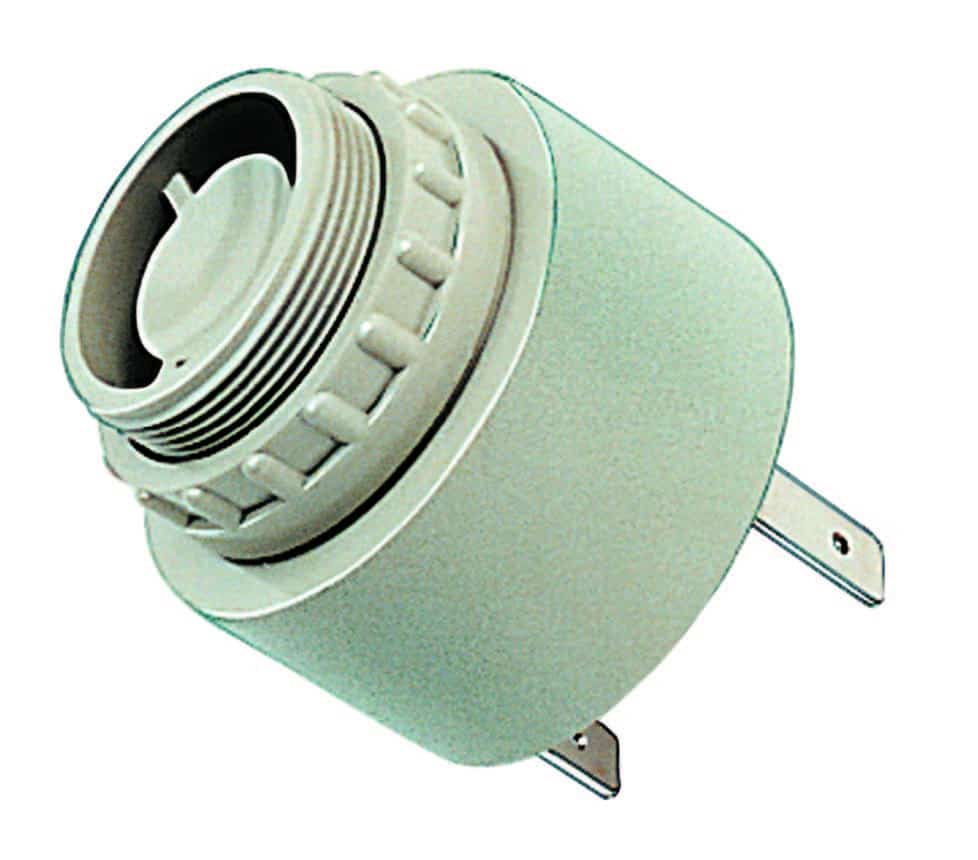 Small round electronic buzzer with metal prongs for electrical connection.