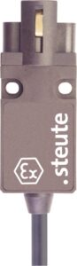 Rectangular industrial sensor with "steute" branding and a cable attached at the bottom.