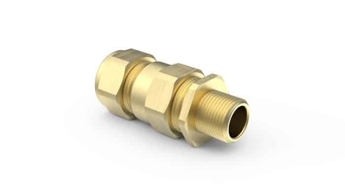 Brass cable gland connector with hexagonal fittings on a white background.