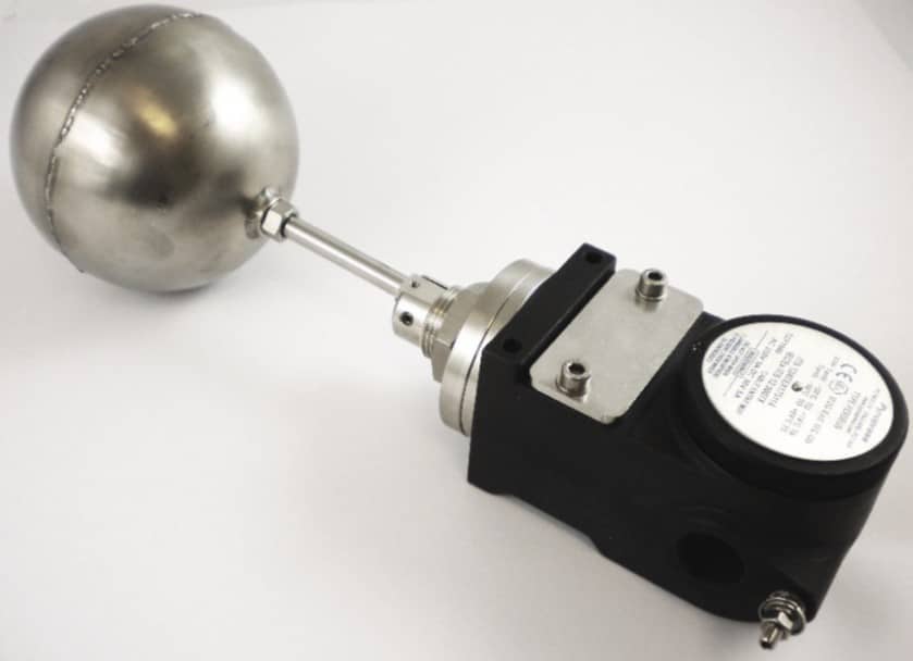 Metal float valve sensor with a spherical float, attached to a black electronic component, on a white background.