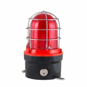 Red industrial warning beacon with protective metal cage and black base, isolated on a white background.